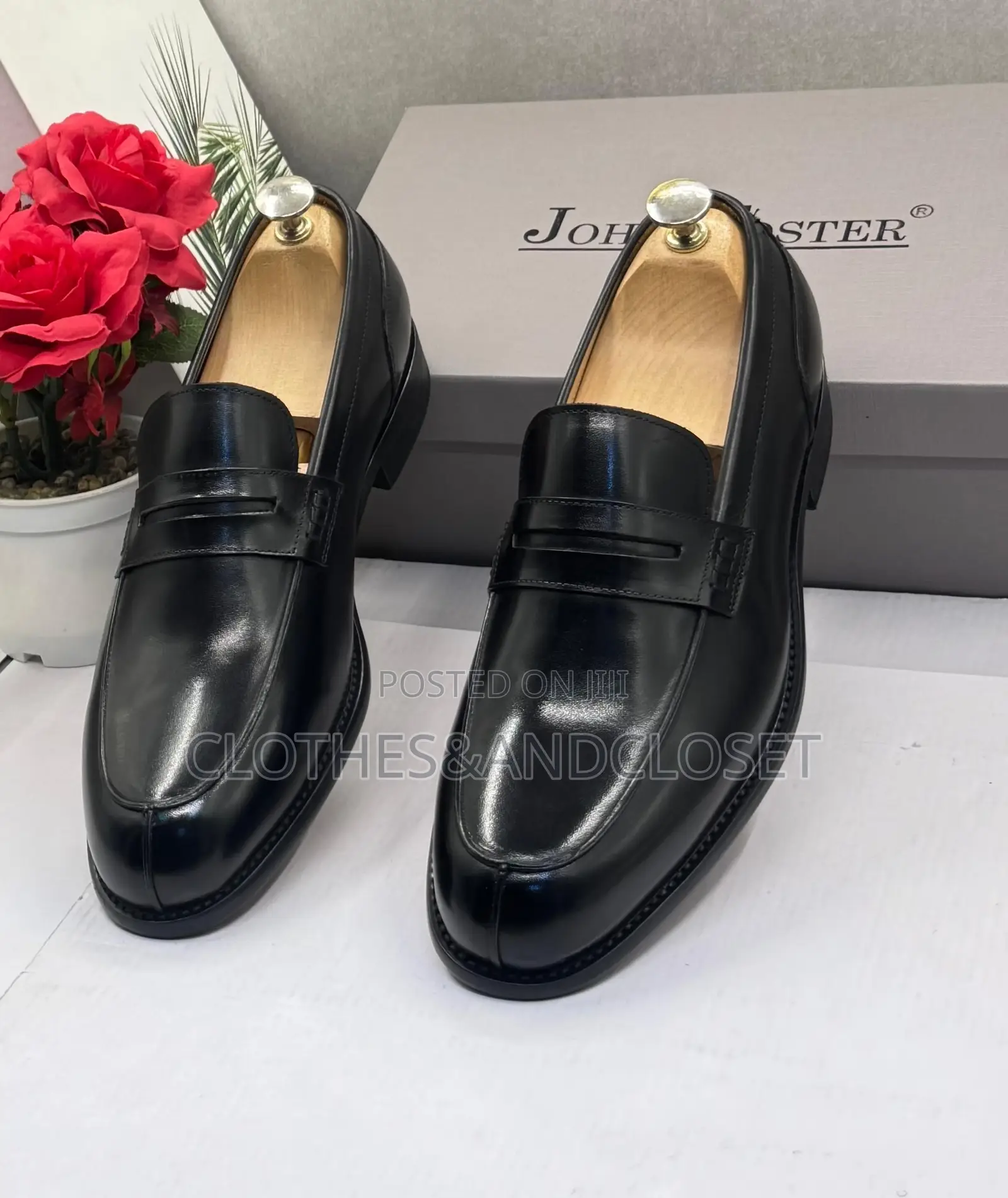 John Foster Black Leather Loafers Feature a Classic Penny Slot Design