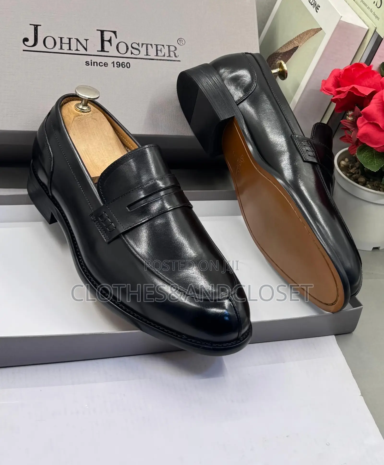 John Foster Black Leather Loafers Feature a Classic Penny Slot Design