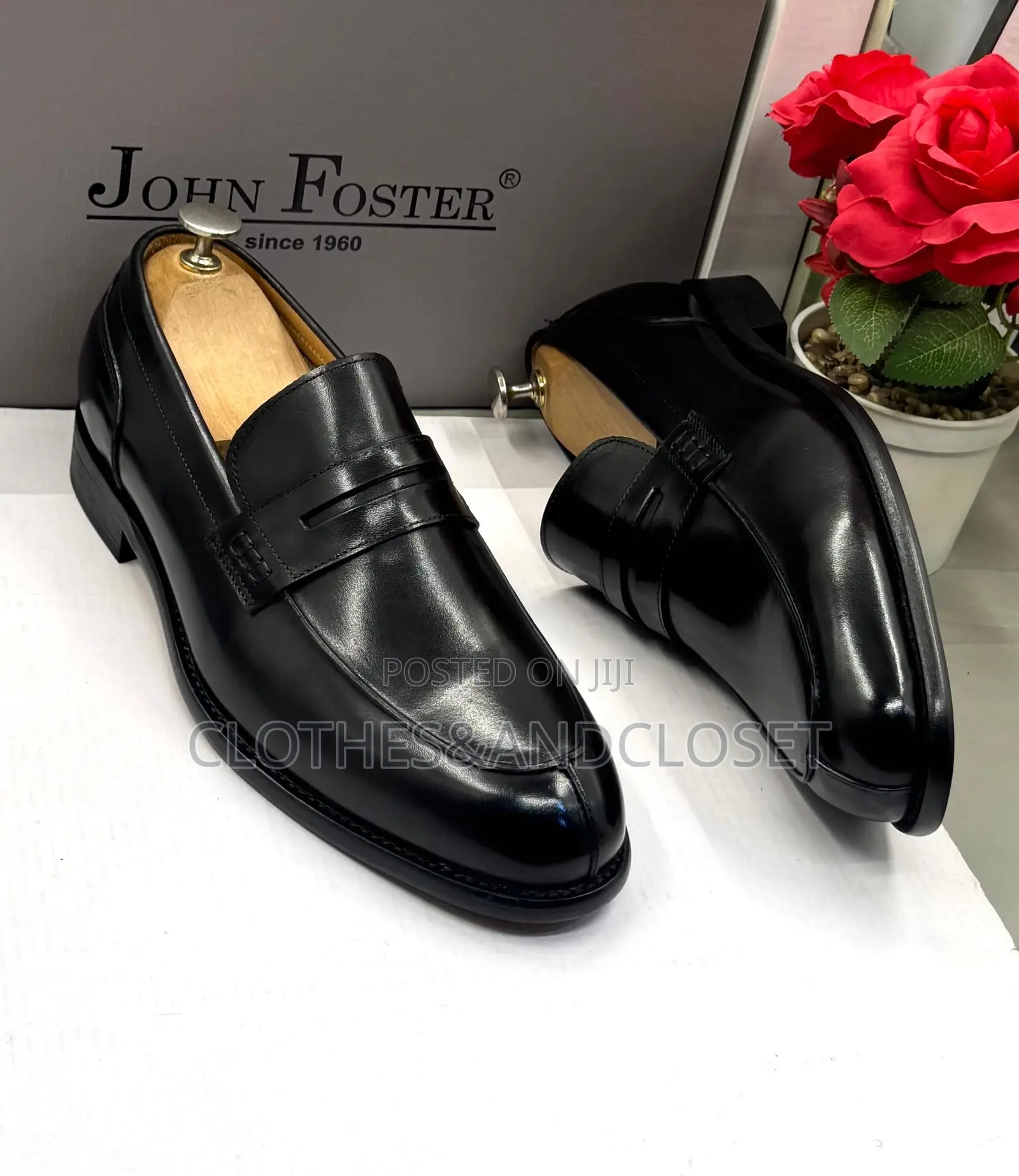 John Foster Black Leather Loafers Feature a Classic Penny Slot Design
