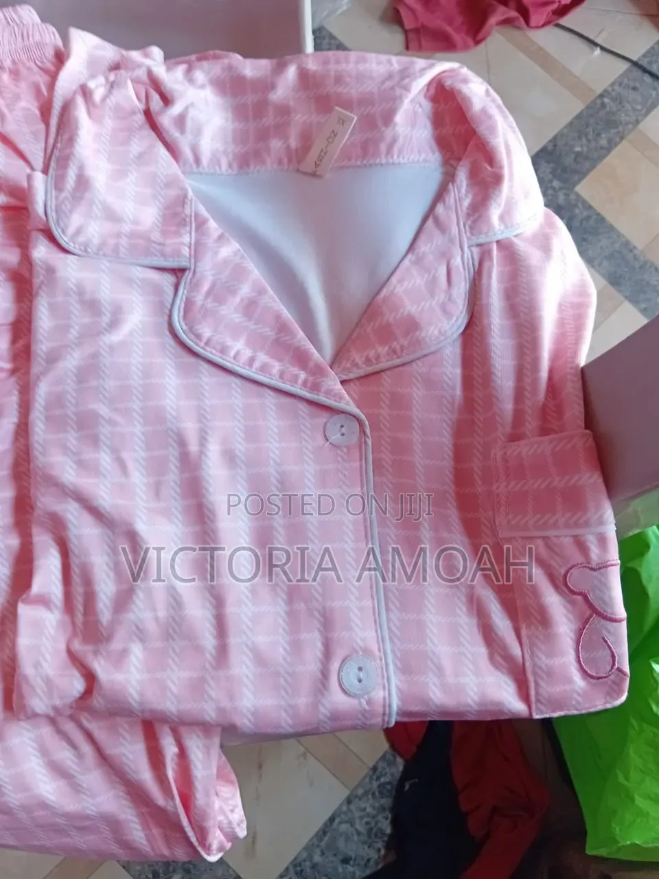 A Pink and White Striped Button-Down Pajama Set.