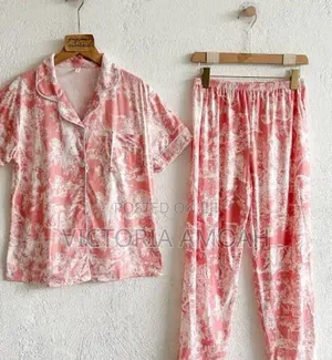 A Pink and White Printed Long- Sleeve Button- Down Pajama Set.