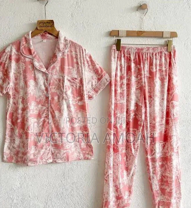 A Pink and White Printed Long- Sleeve Button- Down Pajama Set.