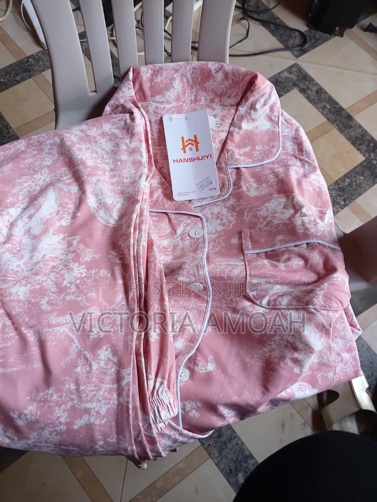 A Pink and White Printed Long- Sleeve Button- Down Pajama Set.